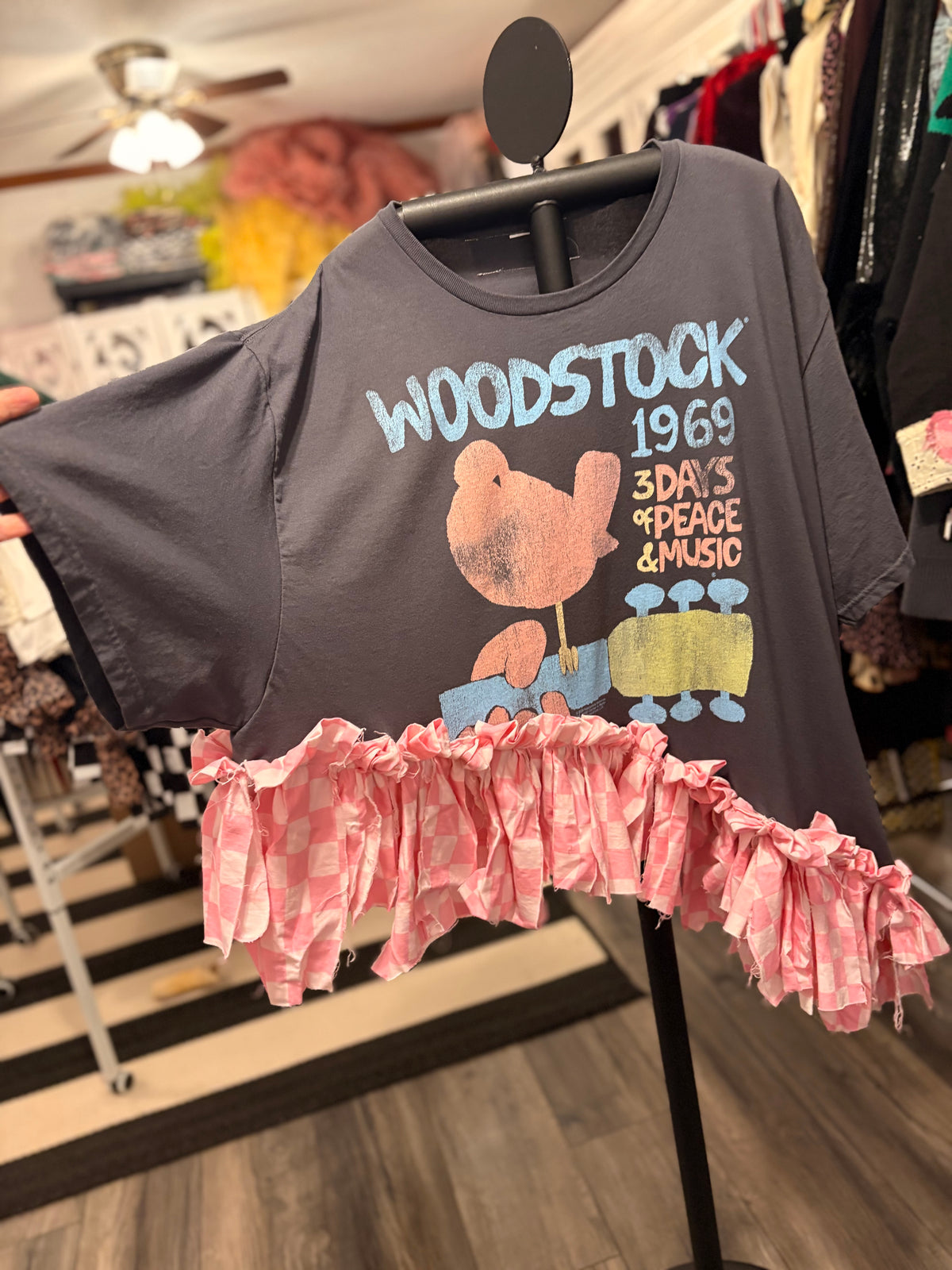 Woodstock Checker Fringe Asymmetrical Tee One Size Fits Small to 3X