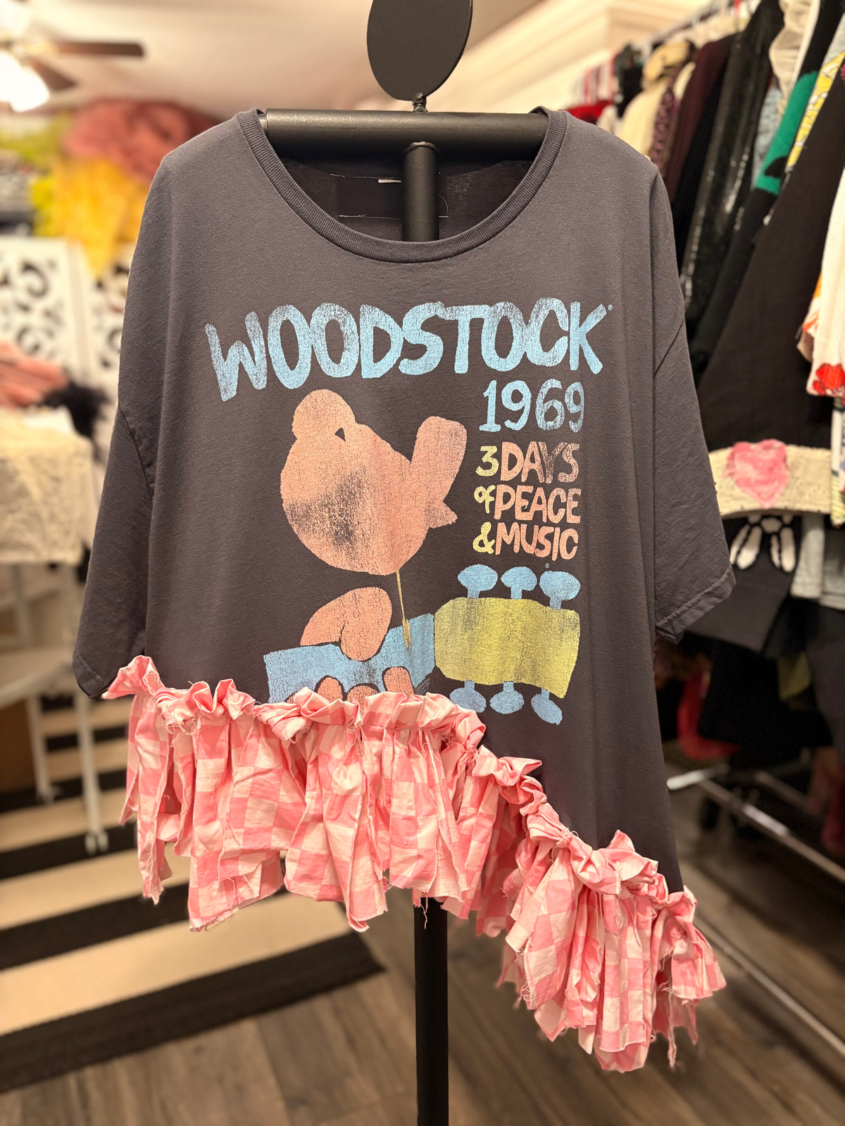 Woodstock Checker Fringe Asymmetrical Tee One Size Fits Small to 3X