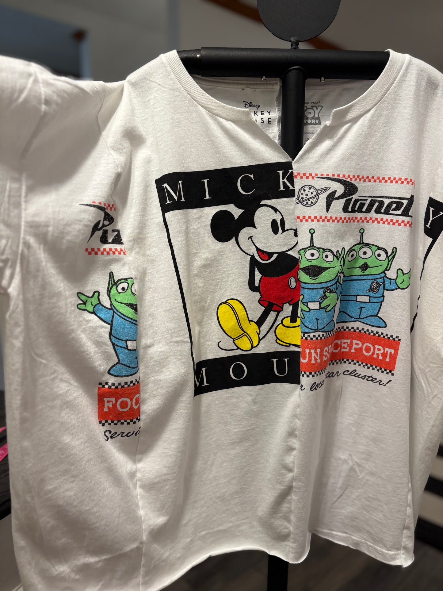 Disney Mickey Mouse and Alien graphic tee for a fun, casual look. Perfect for fans of Toy Story and vintage style. Sleeve