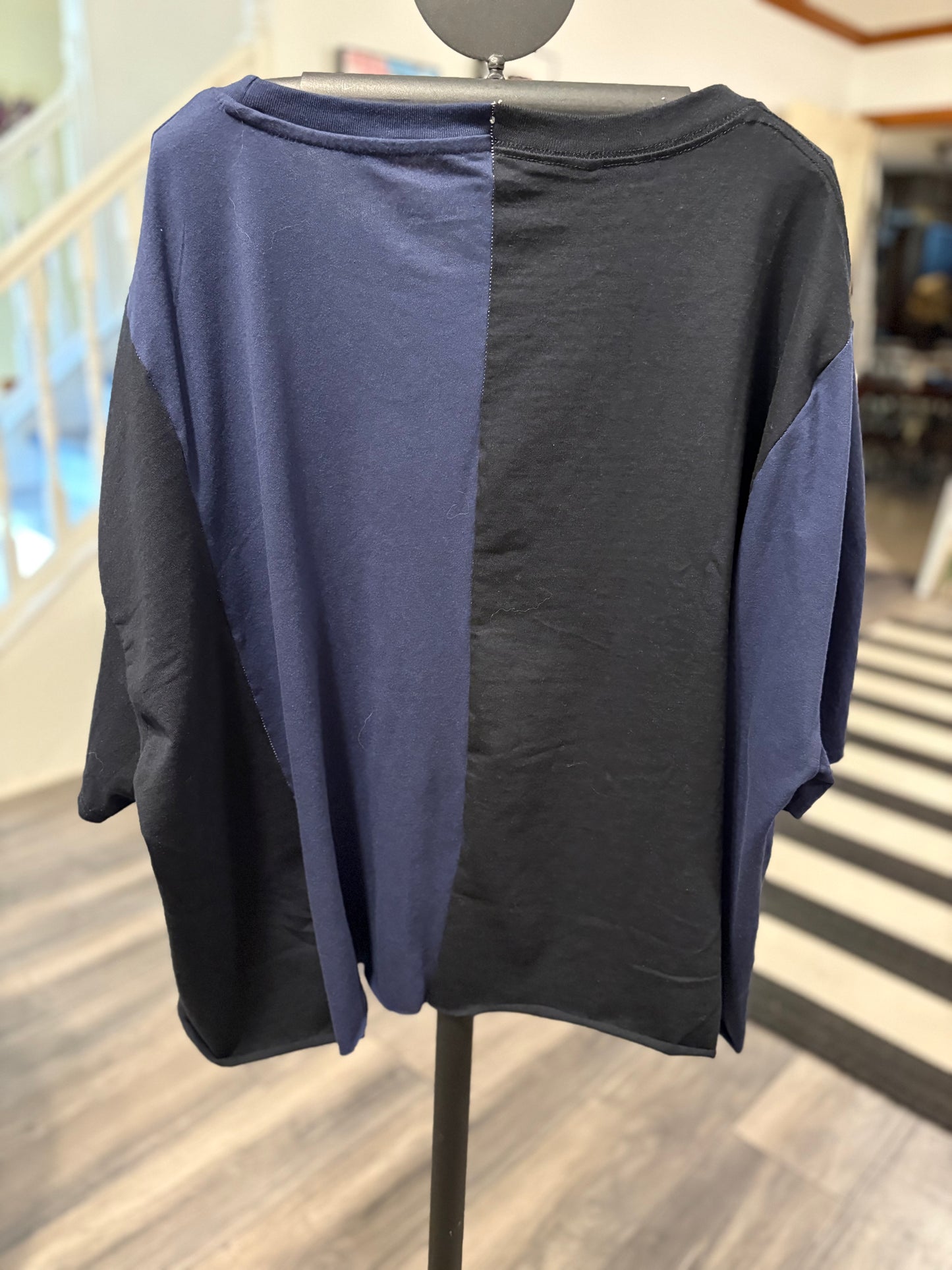 Graphic oversized tee featuring popular cartoon characters and a vibrant "Toon Work" design. Perfect for casual wear! Back