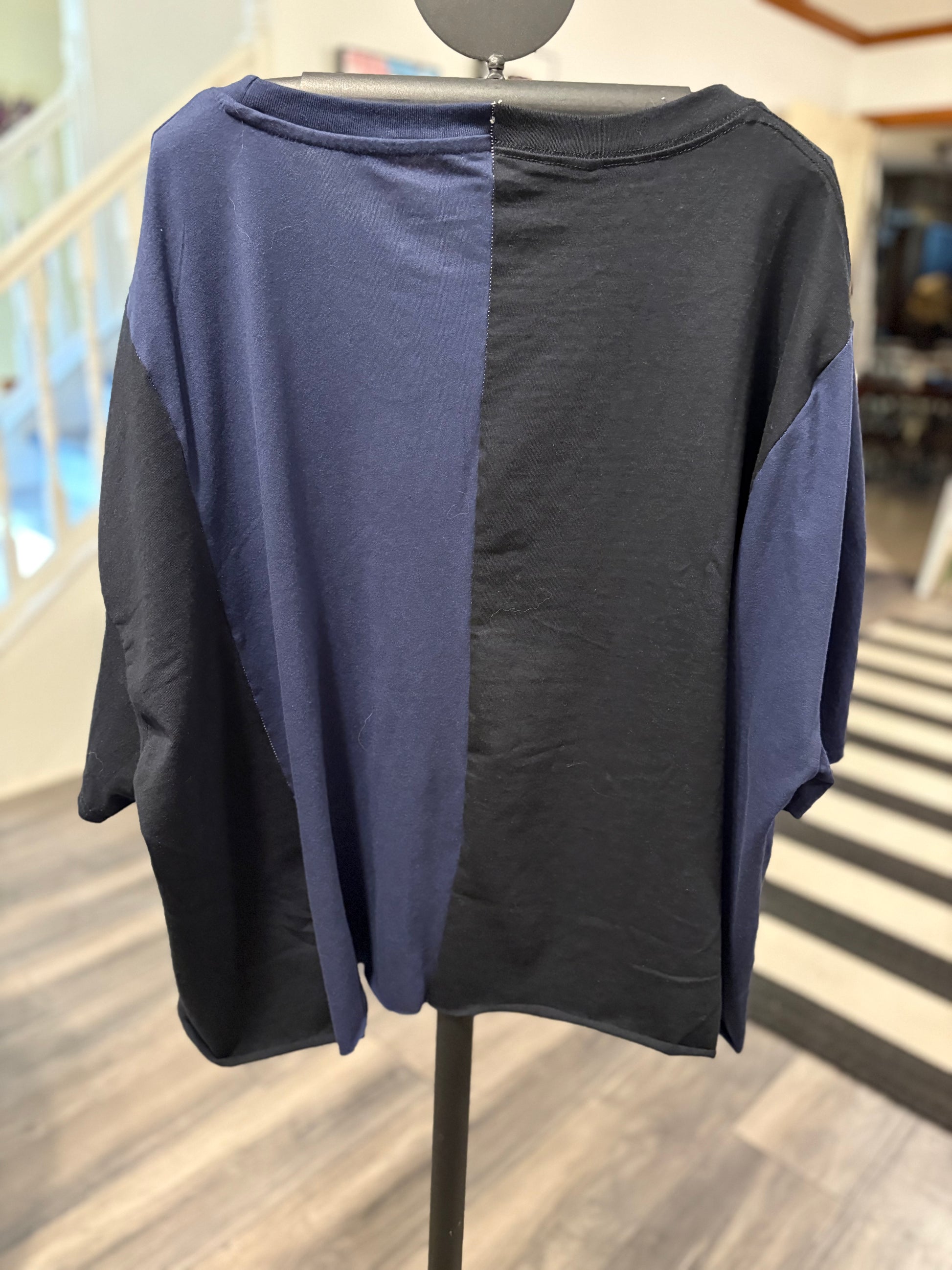 Graphic oversized tee featuring popular cartoon characters and a vibrant "Toon Work" design. Perfect for casual wear! Back